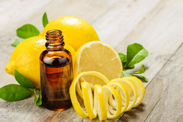 sliced lemons and amber bottle